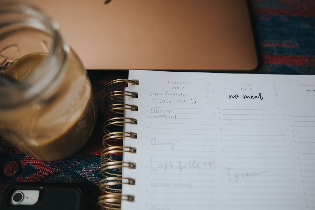 white notebook page on brown wooden table