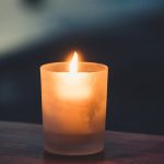 tea light on brown surface