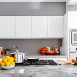 modern white kitchen with marble island
