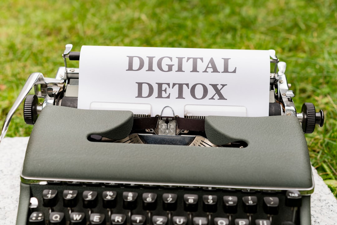 a typewriter with a paper that reads digital detox