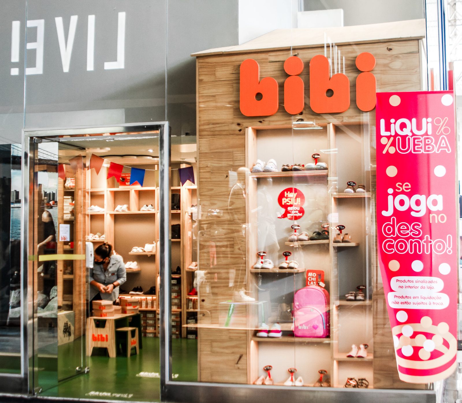 Children interactively choosing and fitting physiological shoes in a bright Bibi boutique
