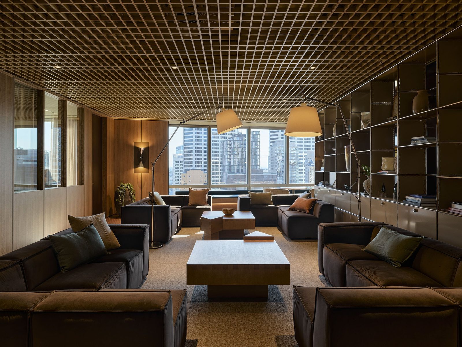 A modern living room beautifully styled with designer sofas, side tables, and lounge chairs from Made in Design