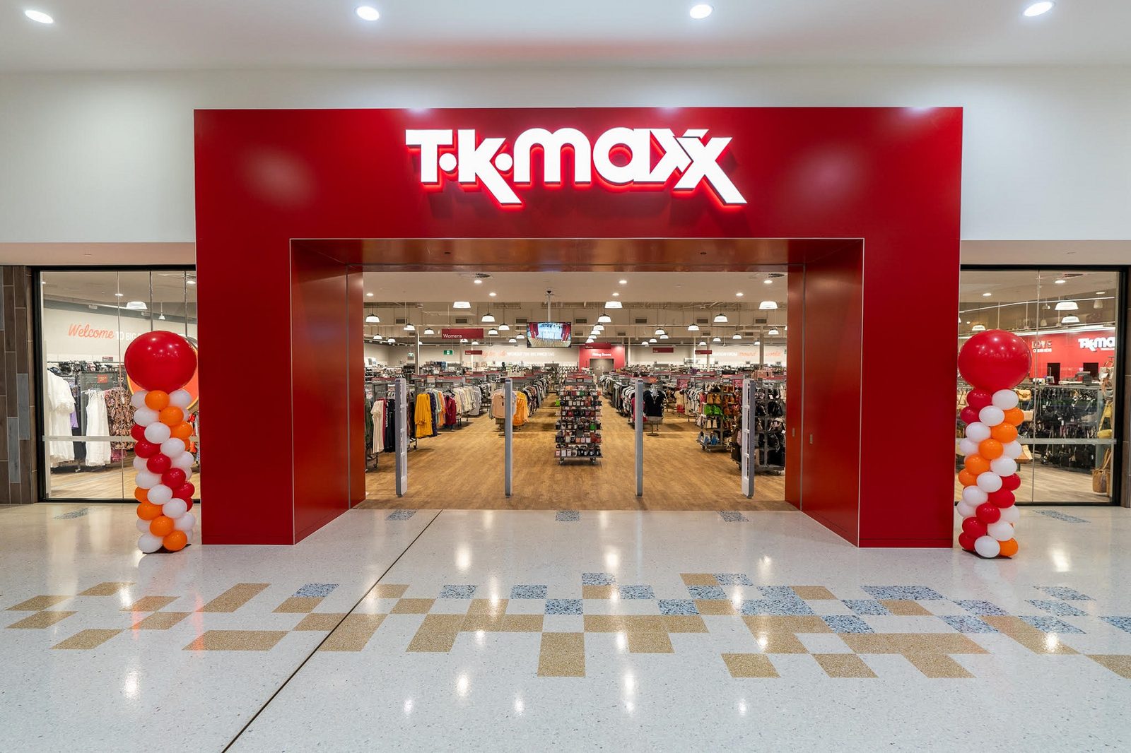 TK Maxx boutique grand opening event showing active shoppers and storefront