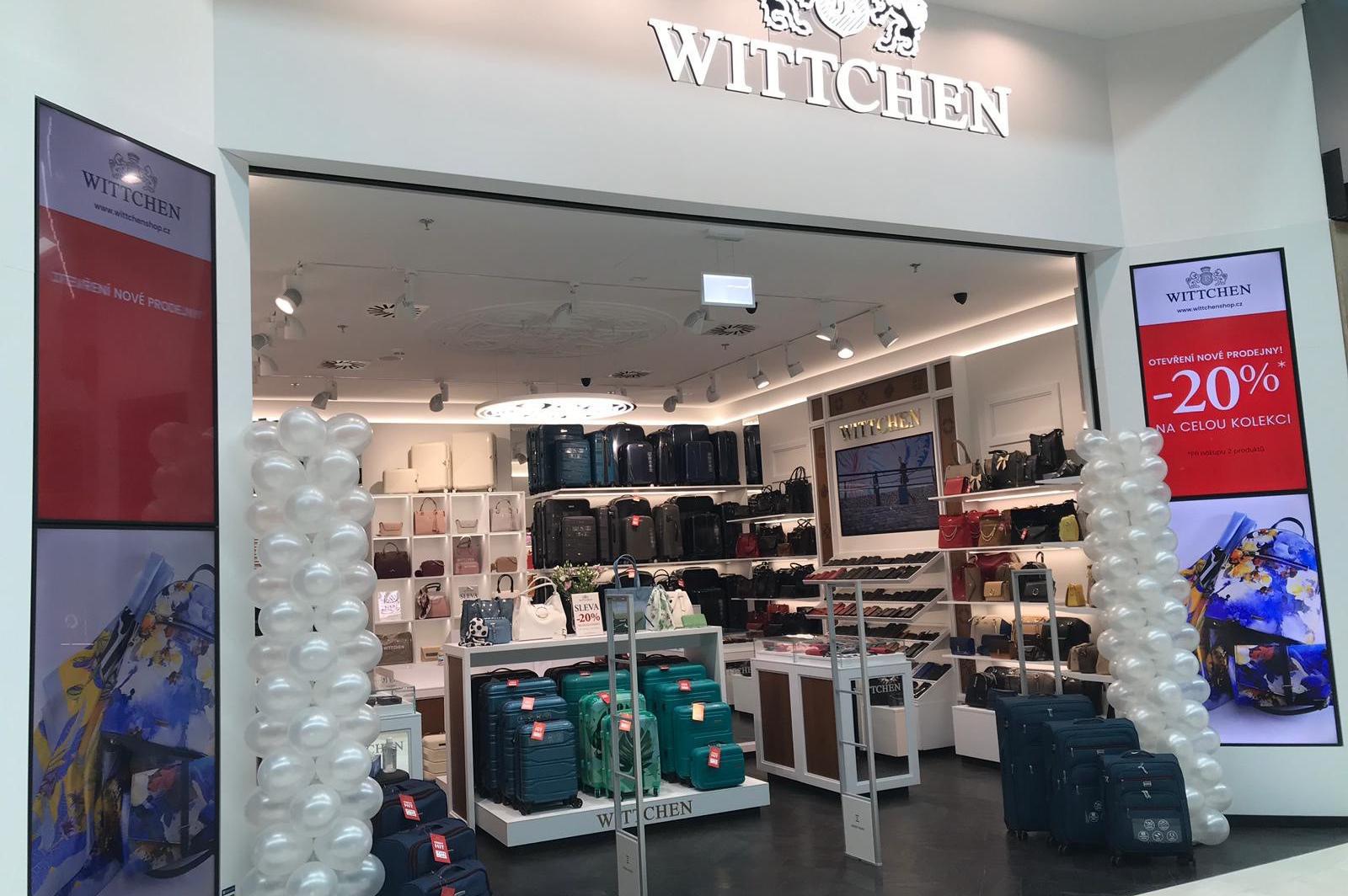 Elegant WITTCHEN leather wallets and small accessories displayed on a premium surface