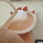 A person holding a compact compact compact compact compact compact compact compact compact compact compact compact