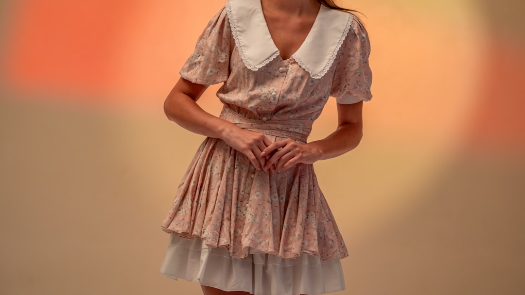 Woman in a floral dress with a white collar