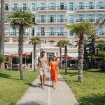 A couple relaxing outside the Vacances Bleues Royal Westminster in Menton