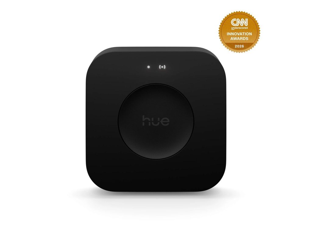 Philips Hue Bridge Pro shown as the central control for a smart lighting setup