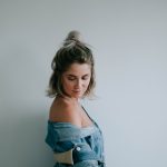 woman beside white wall