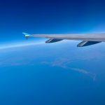 an airplane flying over the ocean