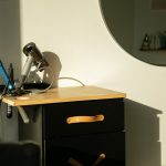 a hair dryer sitting on top of a wooden table